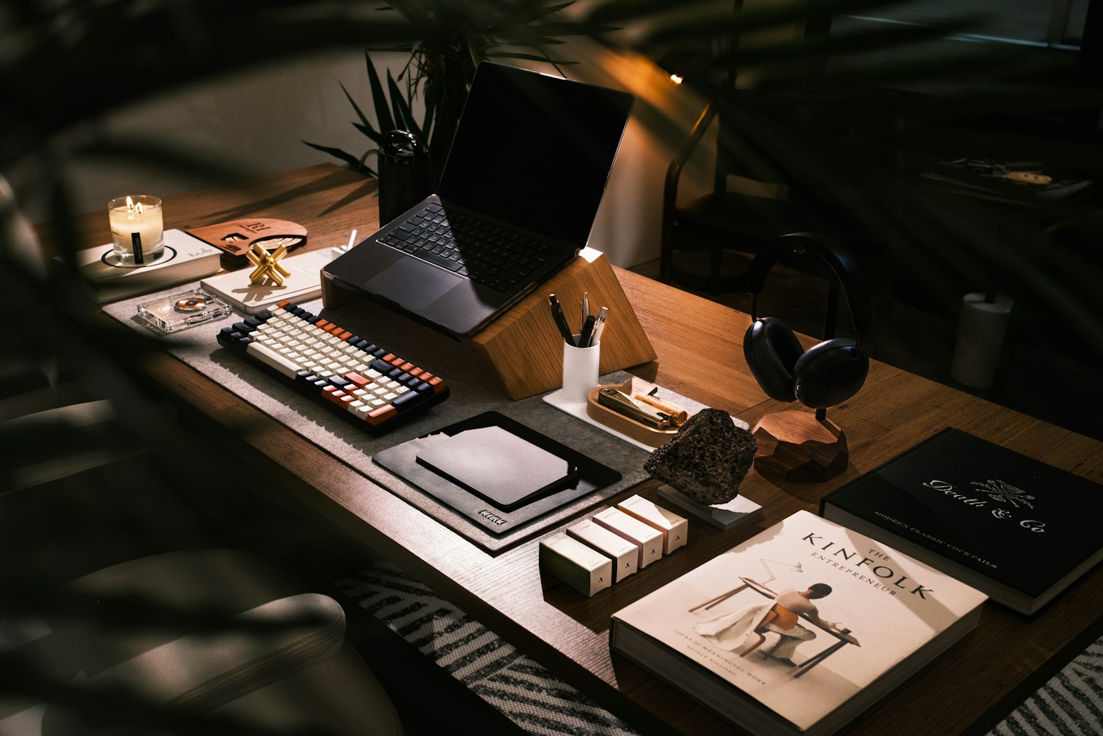 Modern desk setup with laptop and books for productivity