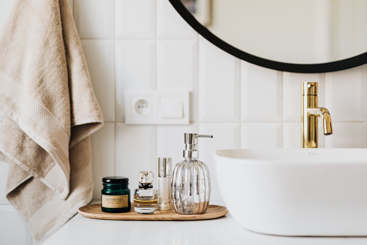 Skin care products arranged on a bathroom counter